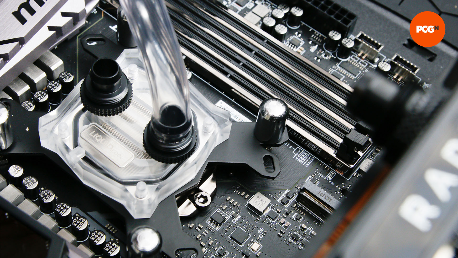 How to water cool your PC: Attach tubing to fitting on CPU waterblock