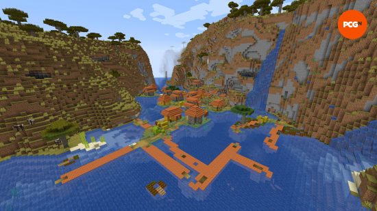 A large savanna village sits on a river in one of the best Minecraft seeds.