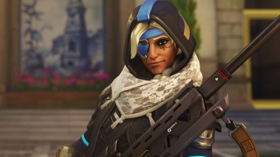 Overwatch 2 tier list: Ana is wearing a blue eyepatch and a hooded coat with a scarf. She has a sniper rifle.