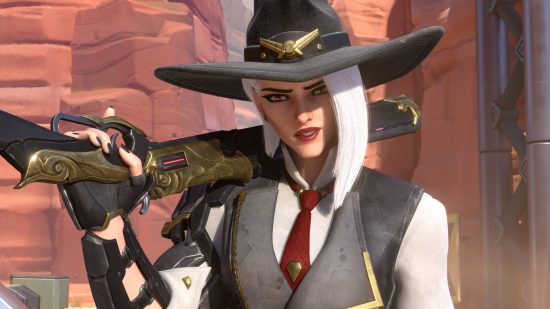 Overwatch 2 tier list: Ashe has her shotgun over her shoulder. She is wearing a red tie, a waistcoat, and a stetson hat.