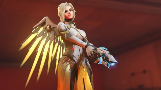 Overwatch 2 tier list: Mercy is wearing a sleak set of armor with angelic wings, and holding a pistol-like device.