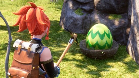 A player looks at a green Palworld egg in the wild.