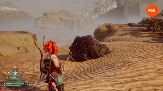 A player standing near some Palworld coal in the desert. She's holding a pickaxe.