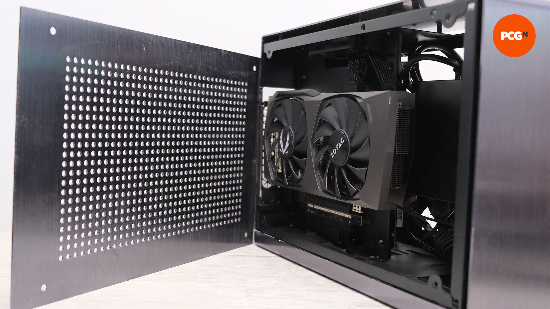 To help with PC cooling, a GPU in a mini ITX is pointing facing out towards a mesh cover