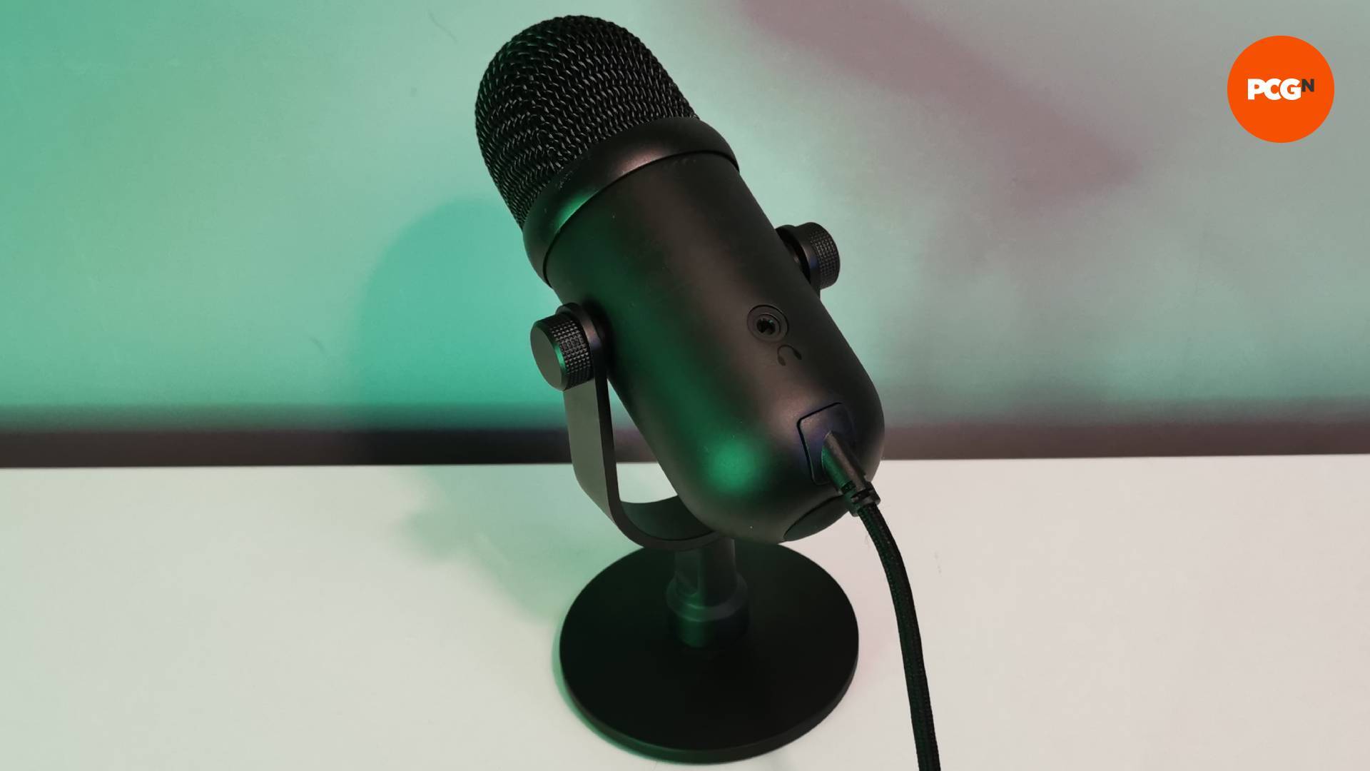 The Razer Seiren V2 Pro microphone on a white table