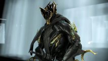 Warframe isn't getting a samurai frame, yet: A man in black armor with golden trips reaches for a sword on a blue background