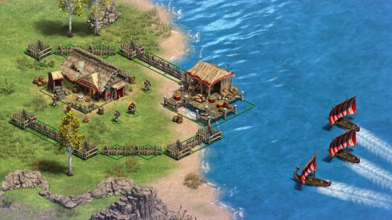 Age of Empires 2: Definitive Edition DLC Victors and Vanquished: barcos vikingos se acercan a un pequeño asentamiento junto al agua en este clásico juego de estrategia.