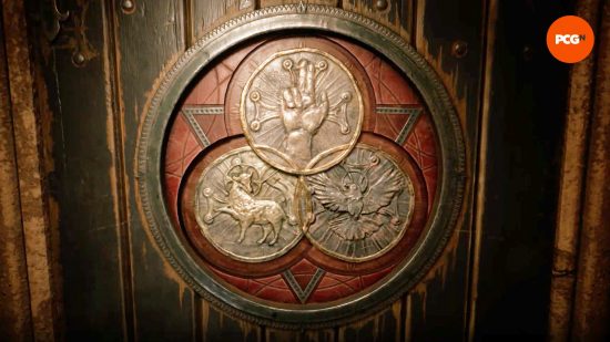 Three medallions in a door in one of the Alone in the Dark puzzles.