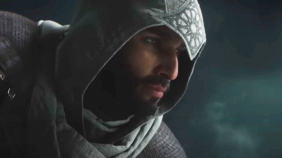 Assassin's Creed Mirage just became the hardest open-world game ever: A bearded Middle Eastern man wearing a hooded cloak with a silver plate on it looking off to the right