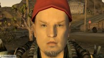 Fallout New Vegas Limp Bizkit mod: a close up of a man with a goatee and red had