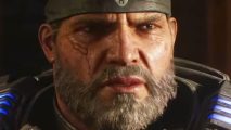 Gears of War creator Cliffy B says 'woke' claims "p*** me off" - Series lead Marcus Fenix, a wide-faced man with a greying beard and wearing a bandana.