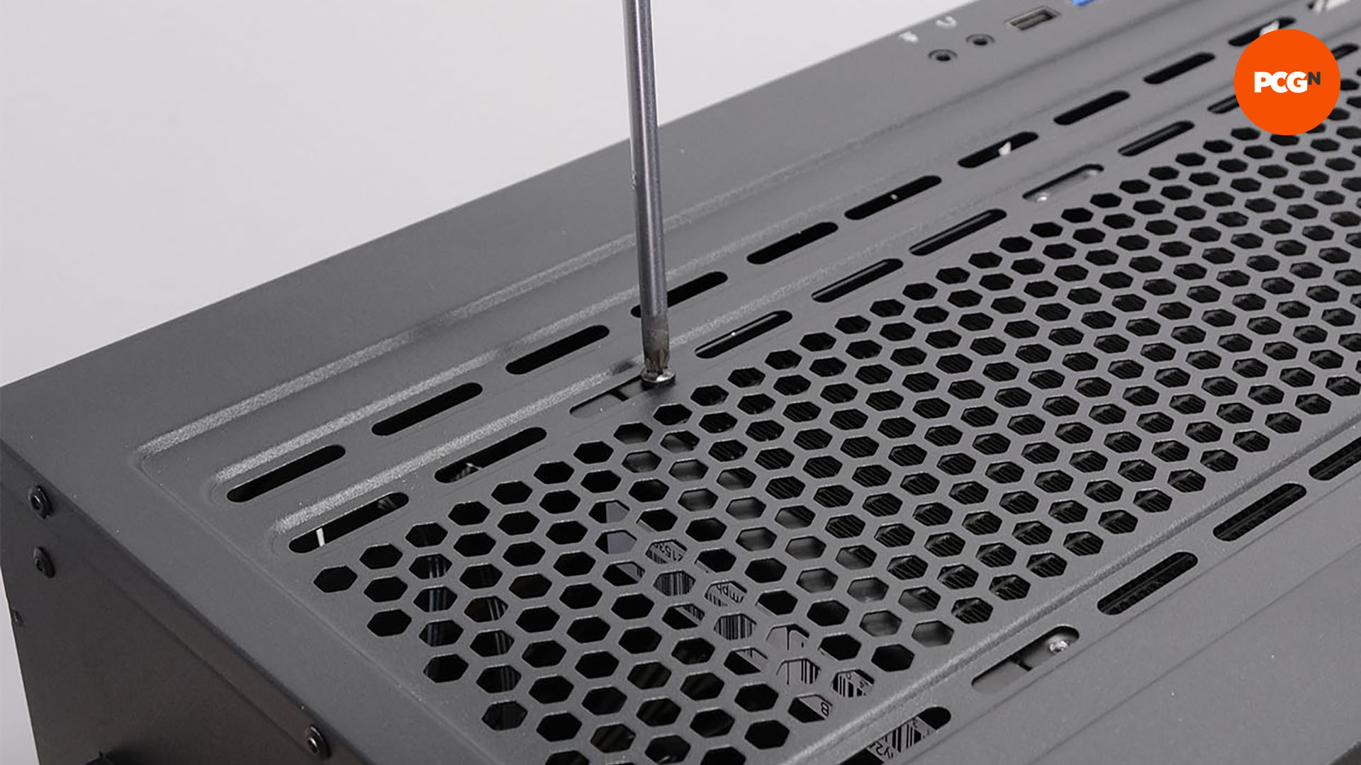 How to build a gaming PC: Screw radiator into case
