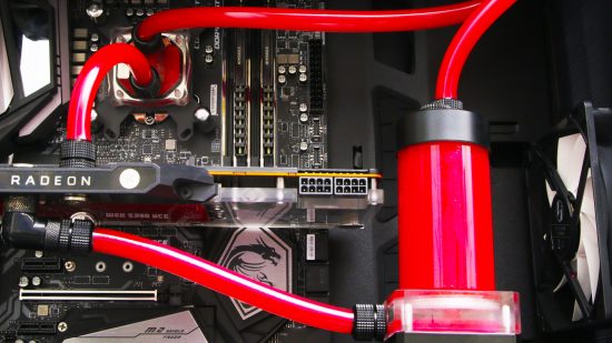 The inside of a gaming PC which is watercooled with red liquid