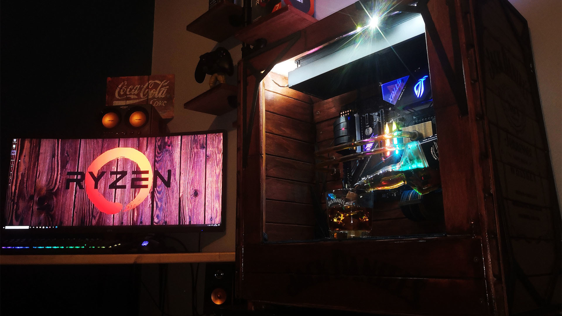 The Jack Daniel's gaming PC on a desk next to a gaming monitor