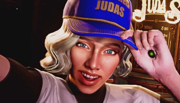 Judas release date: One of the space station's populace dons a cap indicating they shamed Judas and poses at the viewer as if they're taking a selfie.
