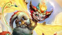 Smolder is finally in League of Legends, but he's been changed again: A small Chinese dragon with a glowing orb on its head, white body, and red and green accents stands on a jade rock looking ay a small dragonfly and smiling