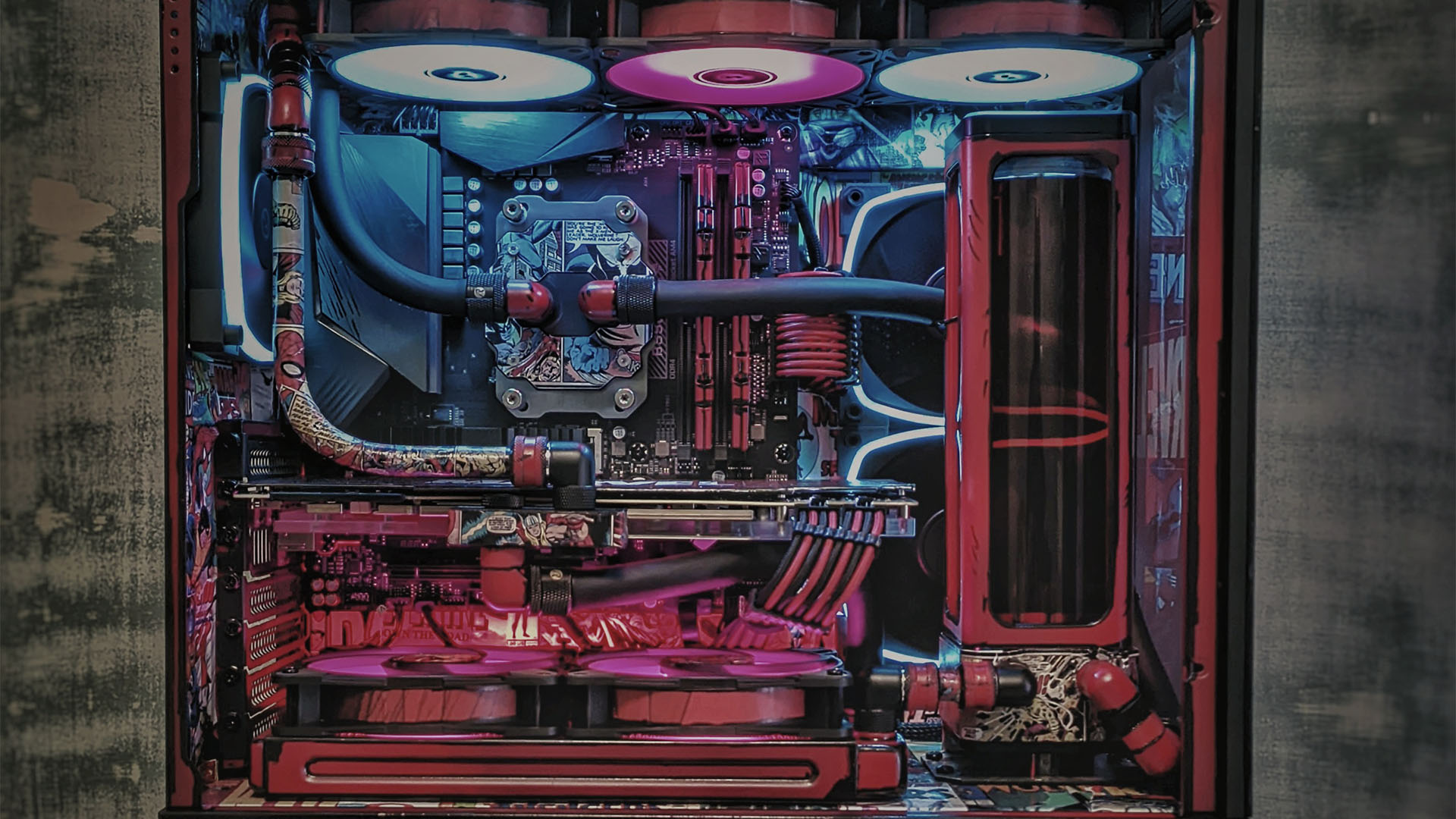 The inside of a red Marvel themed gaming PC complete with comic book strips