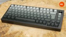 Monsgeek M1W SP review image showing the keyboard on a wooden surface.