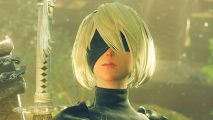 Nier Automata sequel tease: a woman in black with white hair, a blindfold over her eyes, and two swords on her back