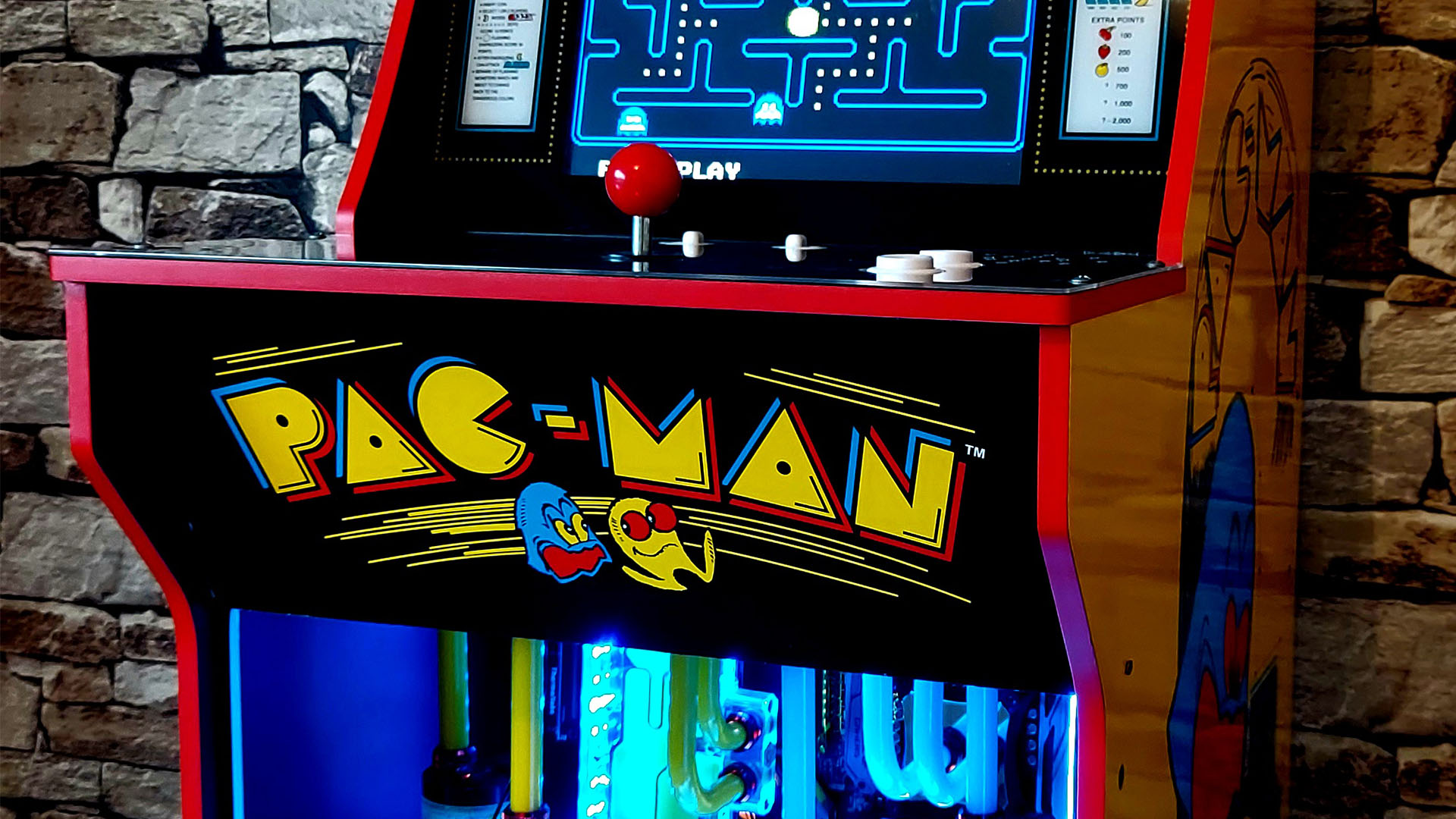 A Pac-man arcade cabinet housing a water-cooled gaming PC