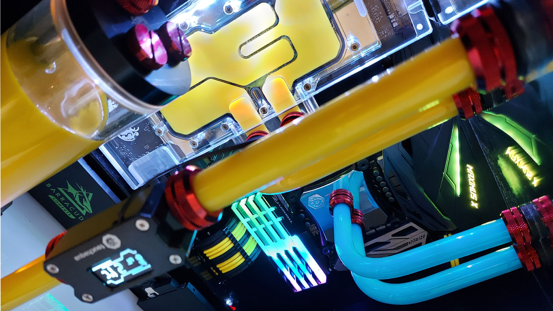 The yellow and blue water-cooled system inside a Pac-Man gaming PC