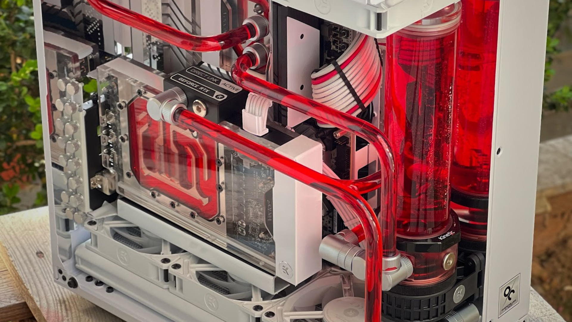A closer look at the red tubing in this white and red watercooled PC