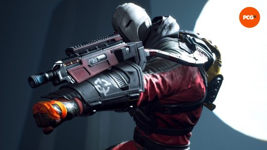 A man in a red suit wearing a silver mask covering his face raises a gun on his arm, readying to shoot