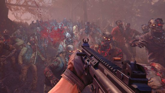 The first person view of Toxic Commando, as a player shoots towards hordes of zombies.