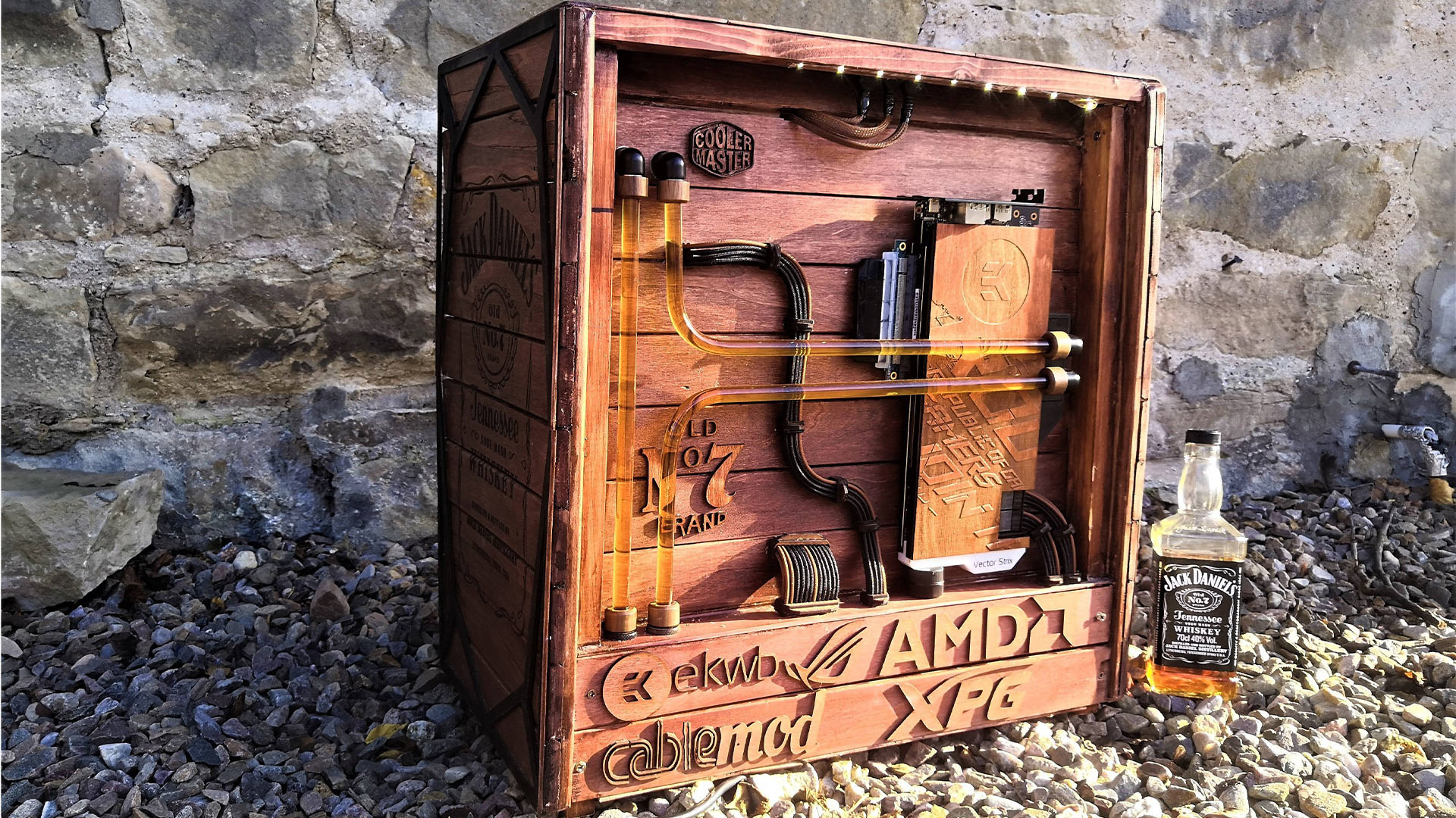 The back of the Jack Daniel's gaming PC, which is wooden, and has whiskey-colored liquid coolant