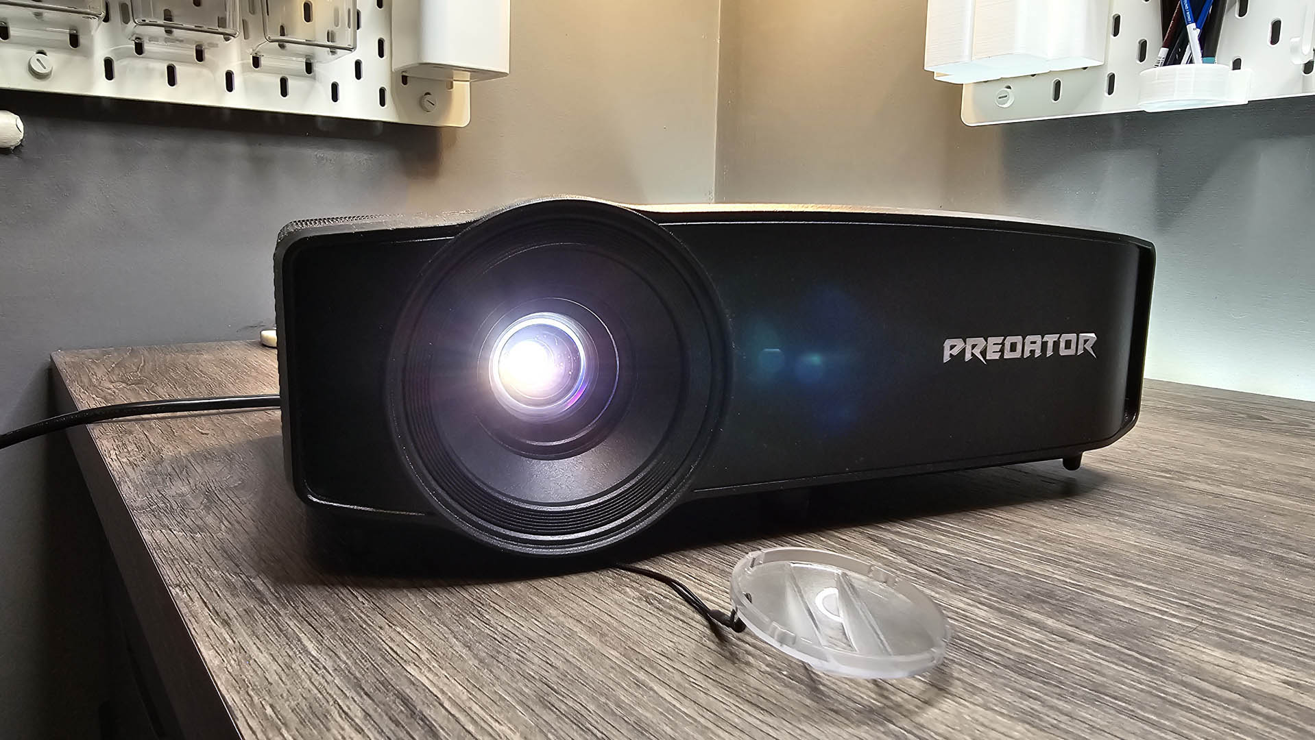The Acer Predator G711 projector on a table