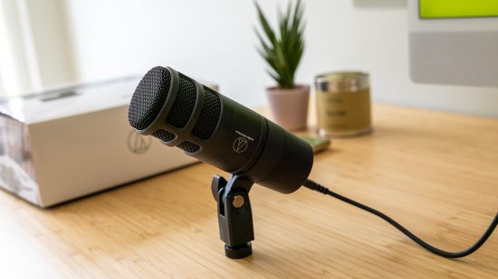 Audio Technica review image showing the microphone on a well lit desk.