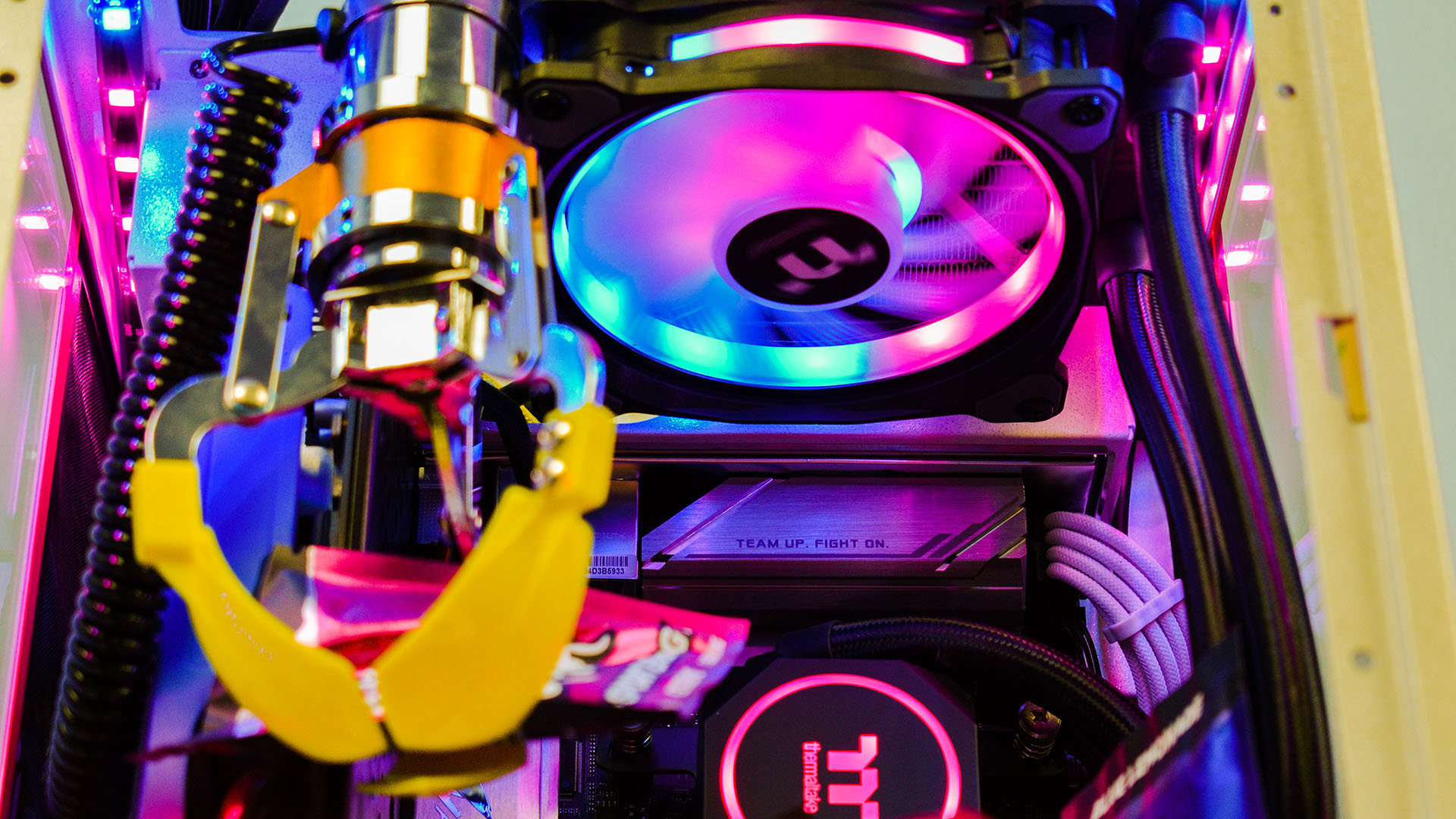 This neon-colored gaming PC looks like a claw arcade machine