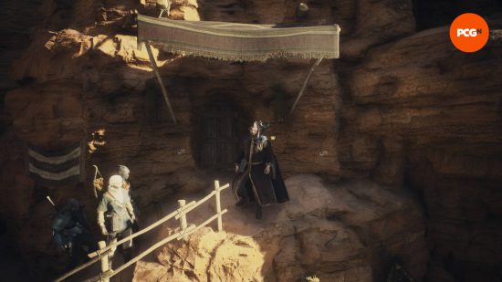 The Arisen and his pawns standing outside the Dragon's Dogma 2 house in Bakbattahl, which is inside a mountain.