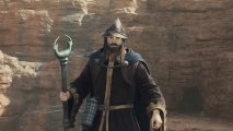 A Dragon's Dogma 2 Sorcerer kitted out in robes, wearing a hat, and has an archistaff.