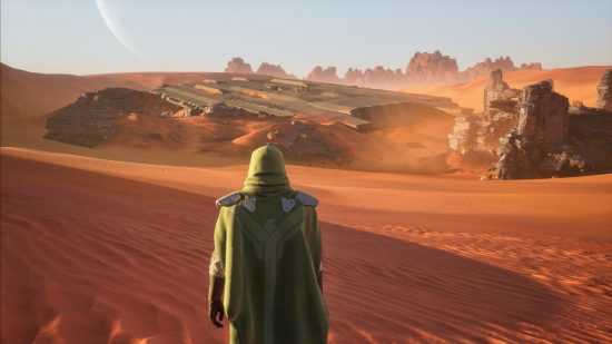 Dune Awakening: Eine verhüllte Gestalt steht mitten in einer riesigen Wüste.