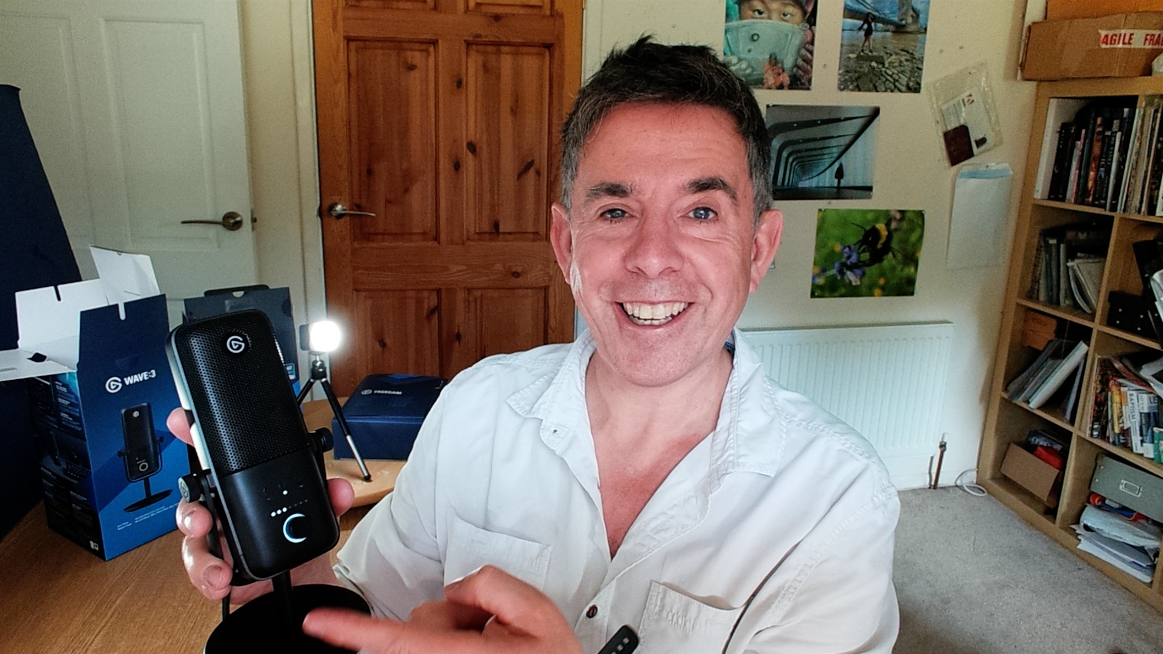 Elgato Facecam review image showing a picture of renowned reviewer, George Cairnes holding the product with a smile on his face.