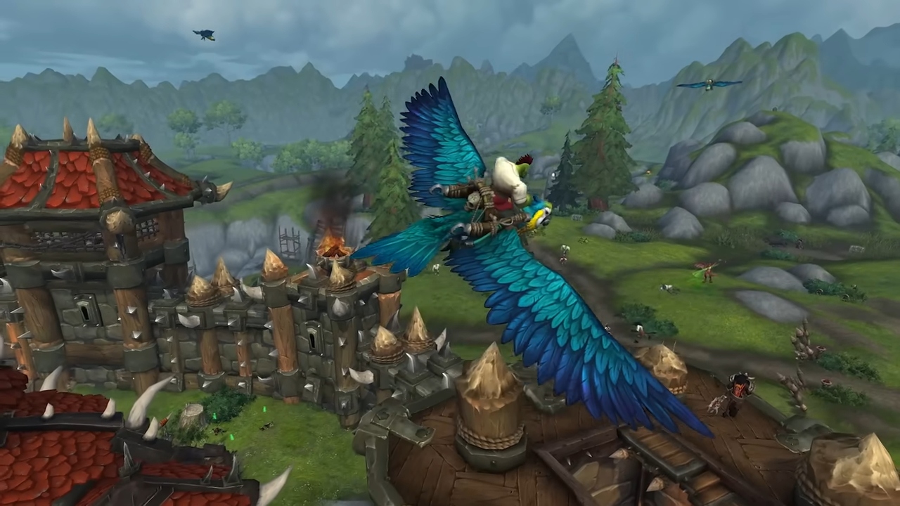  World of Warcraft. Image shows a player soaring above the land on a giant bird.
