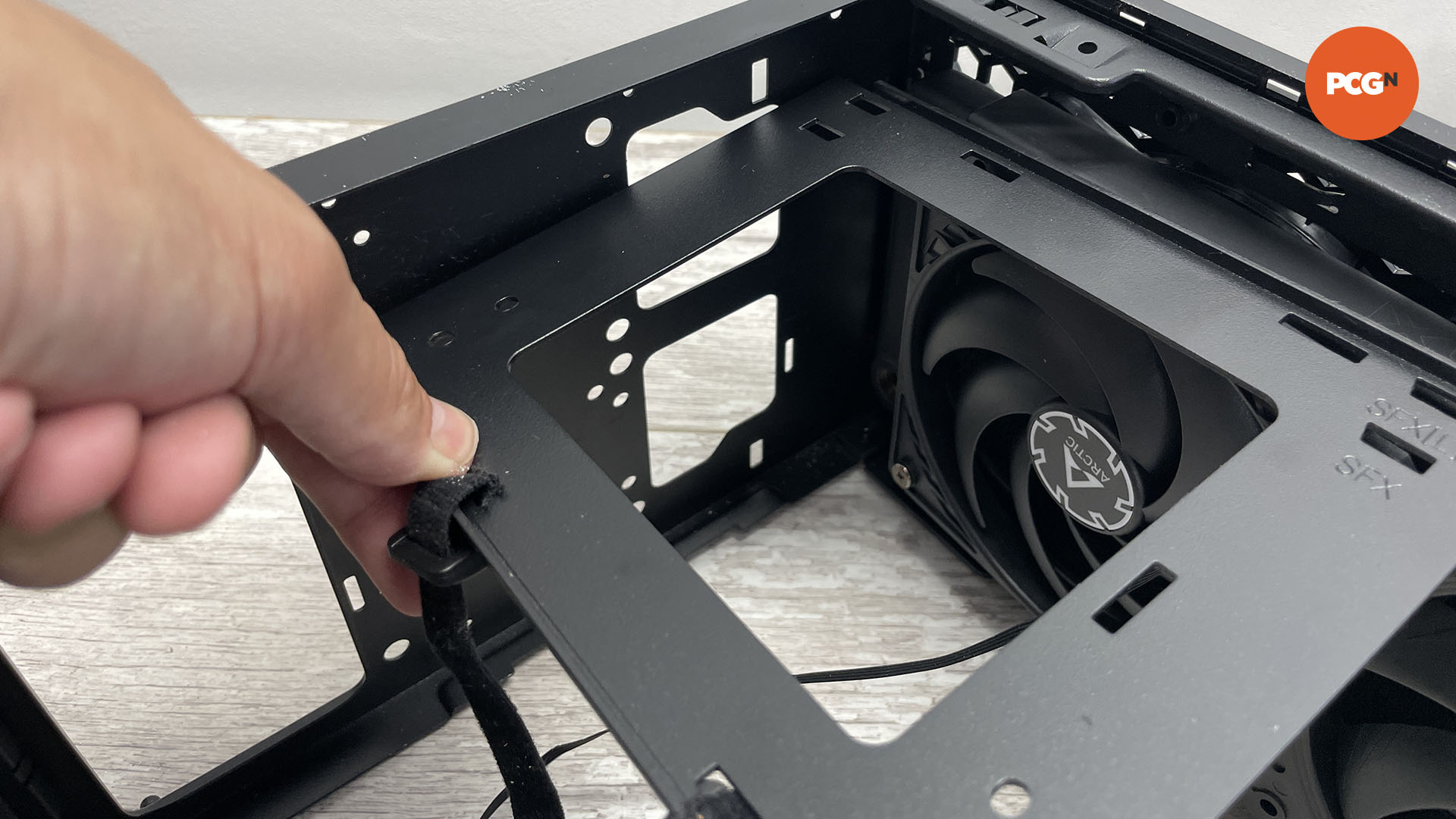 How to move the motherboard tray in your PC case: Check components are loose