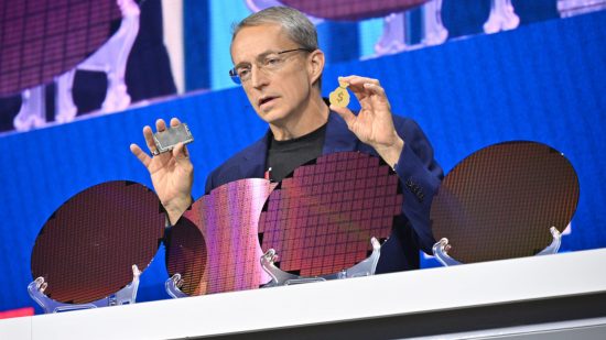 Pat Gelsinger, CEO of Intel, stands behind four chip wafers, while holding a CPU and moneybag in either hand