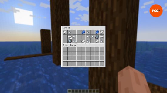 The contents of a treasure chest on the backdrop of a shipwreck in open ocean in one of the best Minecraft seeds.