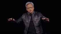 Nvidia CEO Jensen Huang, standing against a black background