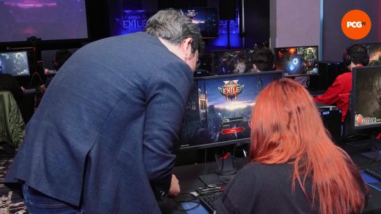 PCGamesN's Danielle Rose talks to Grinding Gears' Jonathan Rogers in front of a PC playing Path of Exile 2.