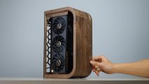 Someone turns on a wooden gaming PC