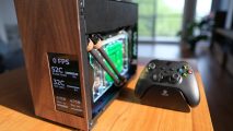The wooden SFF gaming PC next to an Xbox controller