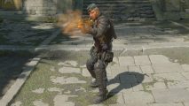Best FPS games: a character shoots a gun which explodes in orange smoke