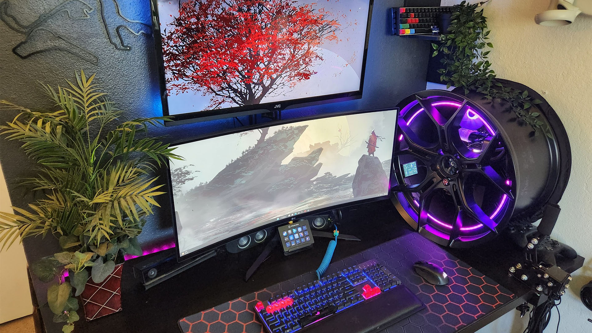 The gaming PC inside a car wheel and illuminated with purple RGB