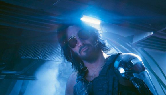 Cyberpunk 2077 Phantom Liberty best quest: Keanu Reeves as a sci-fi man with a metal left arm, on a railing