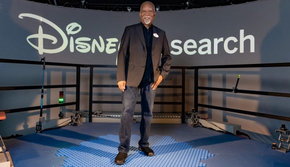 Lanny Smoot standing on his creation, the disney holotile