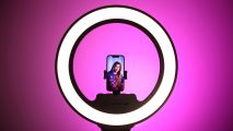 Lume Cube Cordless Ring Light Pro review: image shows a phone mounted in the light about to take a photo of someone.