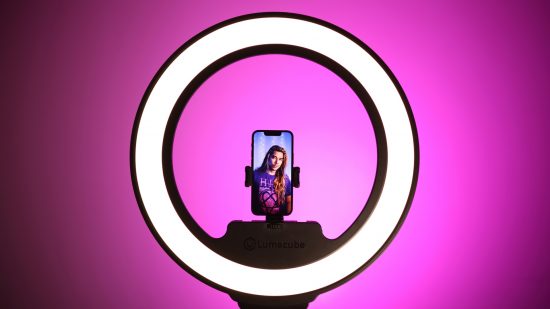 Lume Cube Cordless Ring Light Pro review: image shows a phone mounted in the light about to take a photo of someone.